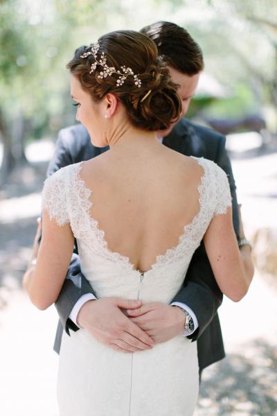 Back view of bride in Rita, an Amy Kuschel wedding gown. Twigs & Honey hair vine, Megan Clouse Photography