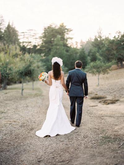 The bride said "I do" in Fillmore, an Amy Kuschel wedding dress.