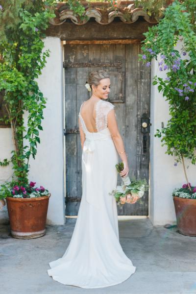 Flirtatious and charming in Amy Kuschel's Lola wedding gown. Photo: Photography by Paulina, as seen on Style Me Pretty