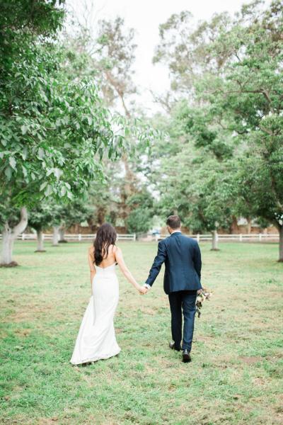 Beautiful coming and going in Halston, wedding gown by Amy Kuschel. Photography: Brooke Borough