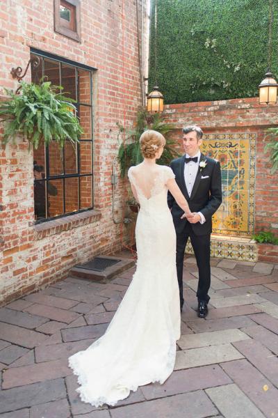 Sophisticated and glamorous in Rita's statuesque and elongating sheath silhouette, wedding dress by Amy Kuschel. Photography: Scott Clark Photo.