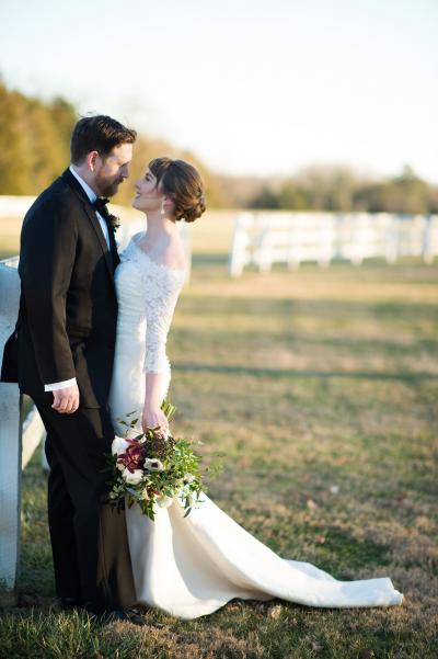 Bride said "I Do" in Amy Kuschel's Sugar wedding gown and Audrey lace topper. Photography: Cramer Photo