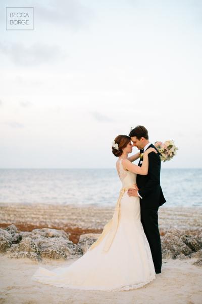 So full of love, the bride wears Amy Kuschel's dramatic trumpet wedding dress, Sierra. Photography: Becca Borge Photography.