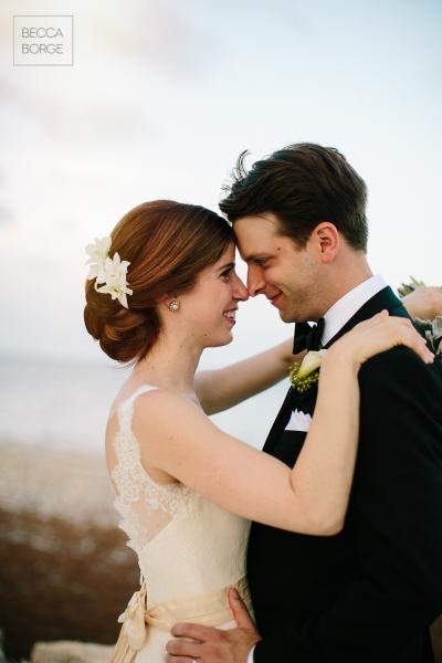 Newlywed bliss. The bride married in Sierra's dramatic trumpet silhouette and classic V-neckline. Wedding dress by Amy Kuschel. Photography: Becca Borge Photography.