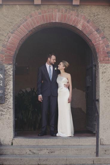 Christina exudes sleek sophistication in Liberty's silk charmeuse sheath silhouette, an Amy Kuschel wedding dress. As seen on Refinery 29.