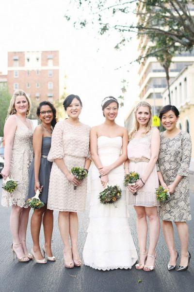 Such a beautiful bride with her lovely bridesmaids in blush, neutral, and gray hues. Bride wears Amy Kuschel's Valentine wedding dress and Gatsby headband. Photography: Max and Friends, as seen on Green Wedding Shoes.