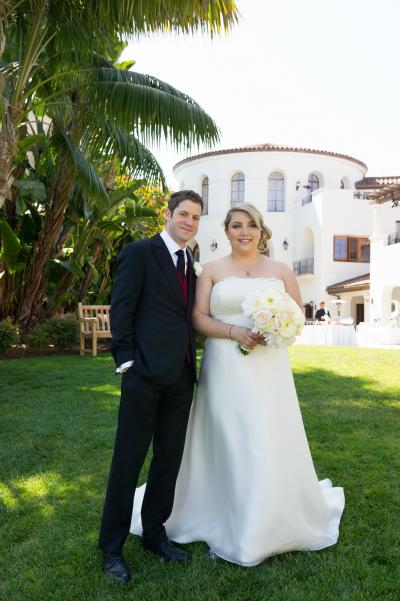 Bride wears Amy Kuschel's Ingrid wedding dress, fabricated in French Alencon lace and silk organza.