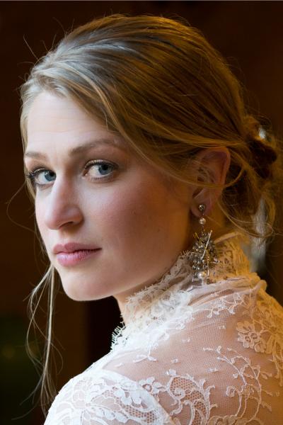 Amy Kuschel's lace shrug adds to Emily's beauty on her wedding day. Photography by Juliette Tinnus, www.juliettetinnusphotography.com.