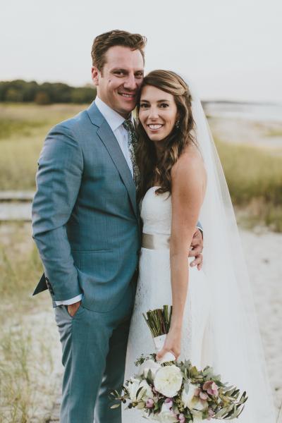 Bride wears Boston, a lace Amy Kuschel wedding gown. Photo by Henry & Mac Photography