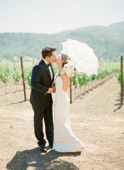 A vintage wedding look. The bride is alluring in Amy Kuschel's silk charmeuse wedding dress, Belvedere. Photography by KT Merry Photography.
