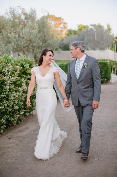 Jacki is the talk of the town in Rita's statuesque and elongating sheath silhouette, a wedding dress by Amy Kuschel. Photography: Jenna Marie Photography.