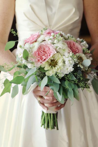 A bridal bouquet of pink, green, and cream is fresh against Mimi's lustrous taffeta, wedding dress by Amy Kuschel. Photography: Amanda Julca. As seen on Style Me Pretty.