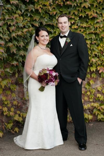 Karen wears Amy Kuschel's lace wedding gown, Kennedy. A classic wine country wedding.