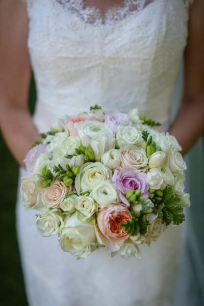 Katelyn with her lovely pastel bouquet in Amy Kuschel's Lauryn gown.