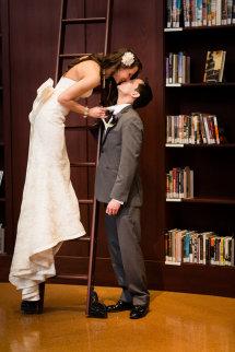 Love in the Library!  Bride is wearing Amy Kuschel's Kennedy wedding gown.