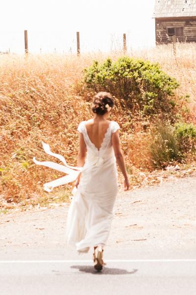 A gorgeous bride in Coretta's layers of lace. Wedding dress by Amy Kuschel.