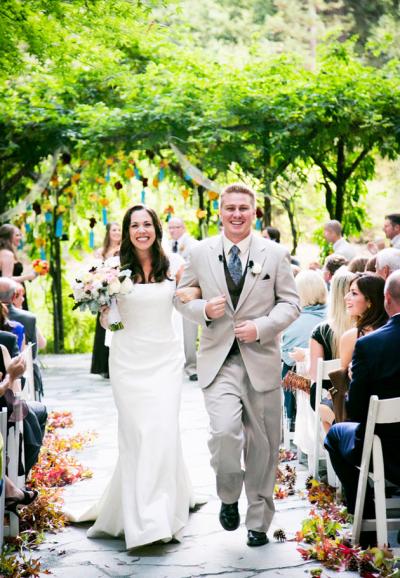 Duchess silk satin and lace make Radiance, an Amy Kuschel wedding dress, perfect for Melisa's vibrant Nestldown nuptials. Photography: Janae Shields Photography.