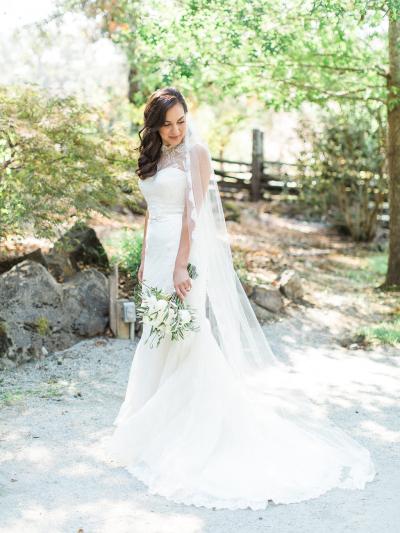 Bride wears Giorgia lace wedding gown and Monroe lace topper, made in San Francisco by Amy Kuschel. Photo by Mallory Miya Photography