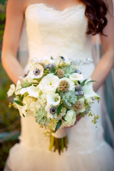 This gorgeous bridal bouquet pairs beautifully with Sabrina's artistic mix of textiles. Wedding gown by Amy Kuschel. Photography: (once like a spark) Photography.