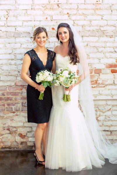 The bride is sophisticated and dramatic in Sabrina's flare trumpet silhouette. Wedding dress: Amy Kuschel. Photography: (once like a spark) Photography.