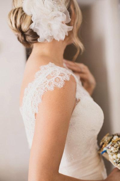 Jaci wearing Amy Kuschel's Rita gown with Organza flower hair piece.