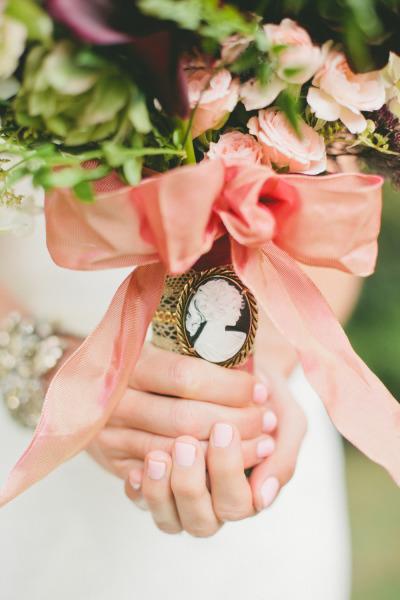 Amy Kuschel's Sabrina "Takes the Plunge" wedding dress. Floral by Seed Floral. Photo courtesy of Onelove Photography. As seen on Style Me Pretty.