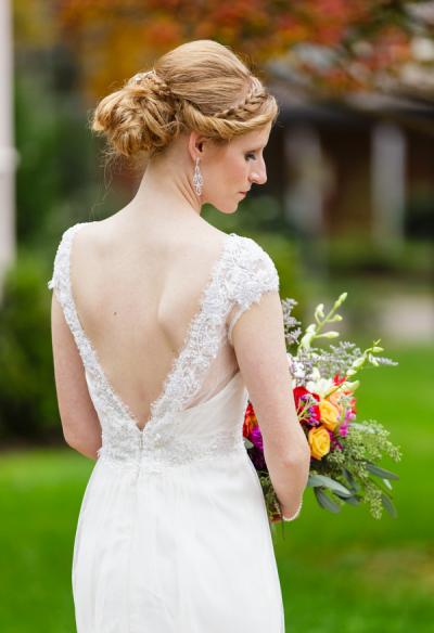 Bride wears Dandelion, an Amy Kuschel wedding gown. Erin Costa Photography