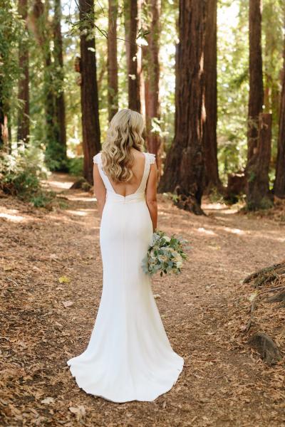 Bride wears Avedon, an Amy Kuschel wedding dress made in San Francisco. Photo by Simone Anne Photography