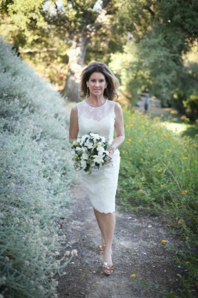 Chic, charming, and sophisticated in Amy Kuschel's lace sheath wedding dress, Olive.