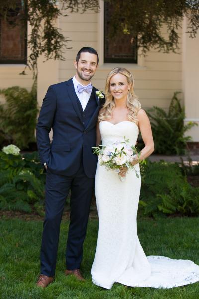 Bride wears Cassidy, an Amy Kuschel lace wedding gown made in USA. Photography: Allyson Wiley