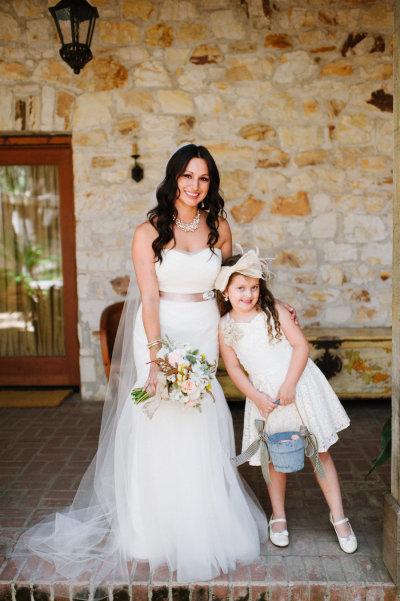 Marie and her flower girl.  Bride wears Amy Kuschel's Viva wedding gown. 