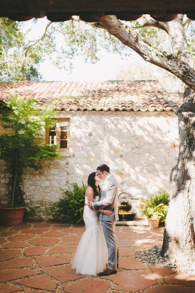 Marie and Matt at Holman Ranch. Bride is wearing Amy Kuschel's Viva wedding gown.