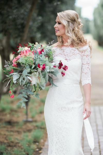 Elegant and glamorous in Amy Kuschel's Cassidy lace wedding gown and Audrey topper. Essence Photography, www.CapturetheStory.com