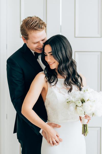 Beautiful bride wears Harlem, an Amy Kuschel wedding dress. Assaf Friedman Photography